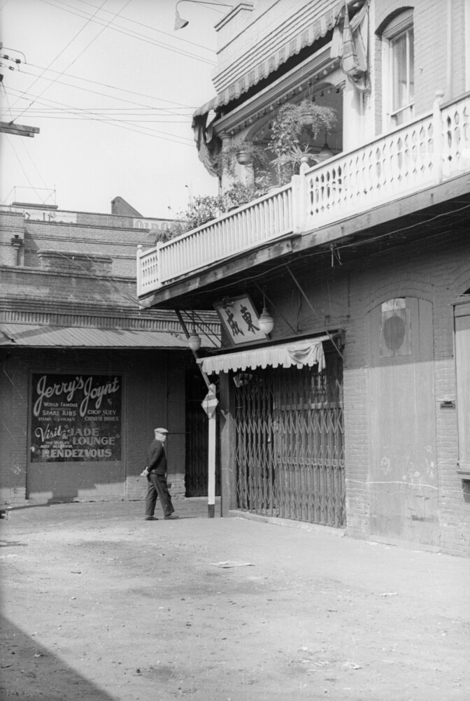 A man walks through the streets of old Chinatown.