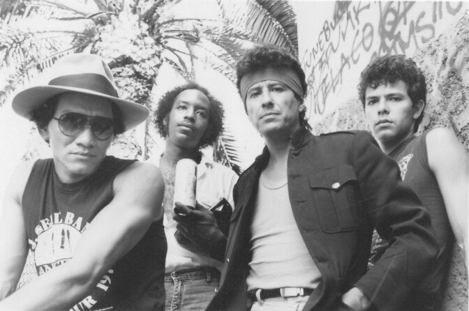 Four men in a band in a black and white photograph.