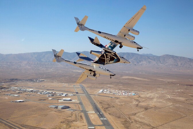SpaceShipTwo carried by its mothership high above the Mojave Air & Space Port. | Mark Greenburg/Virgin Galactic