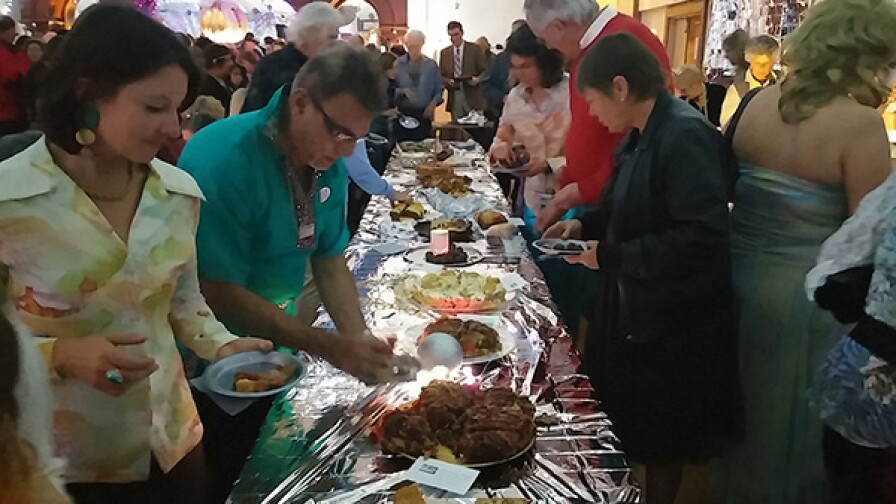 Guests at the annual Fruitcake Festival in the Inyo county town of Independence sample 1970s disco-themed fruitcakes in December 2014.