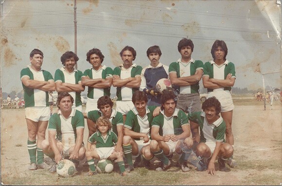 Nicholas Guzmán, shown here in his blue goalie's jersey, with his soccer team.