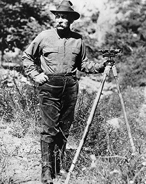 Portrait of William Mulholland with a surveyors scope on a tripod (1908-1913)
