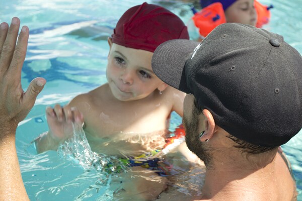 Student getting a high five from his instructor | Photo by Sarah Silcox