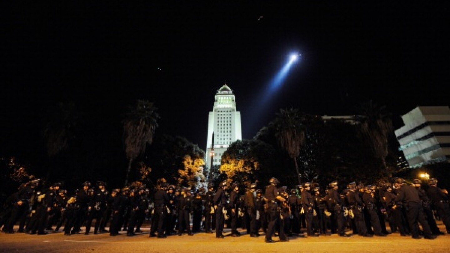Hundreds of L.A. Police Department officers wait to walk into the Occupy Los Angeles protest encampment following a raid by LAPD on November 30th | Photo by Kevork Djansezian/Getty Images