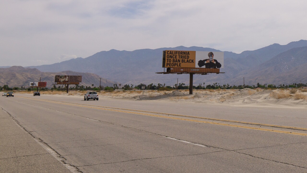 Xaviera Simmons' "Because You Know Ultimately We Will Band A Militia" is a series of billboards along Gene Autry Trail as part of Desert X 2021.