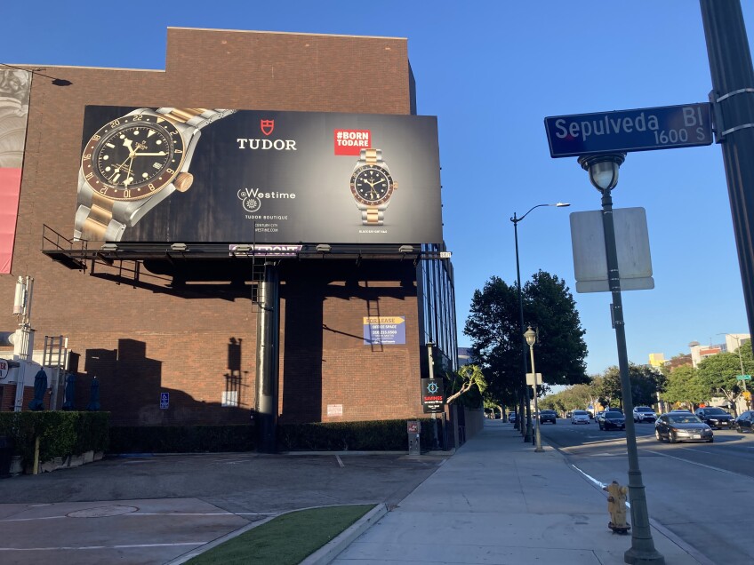 A billboard on Santa Monica Boulevard near the 405 freeway advertises luxury watches