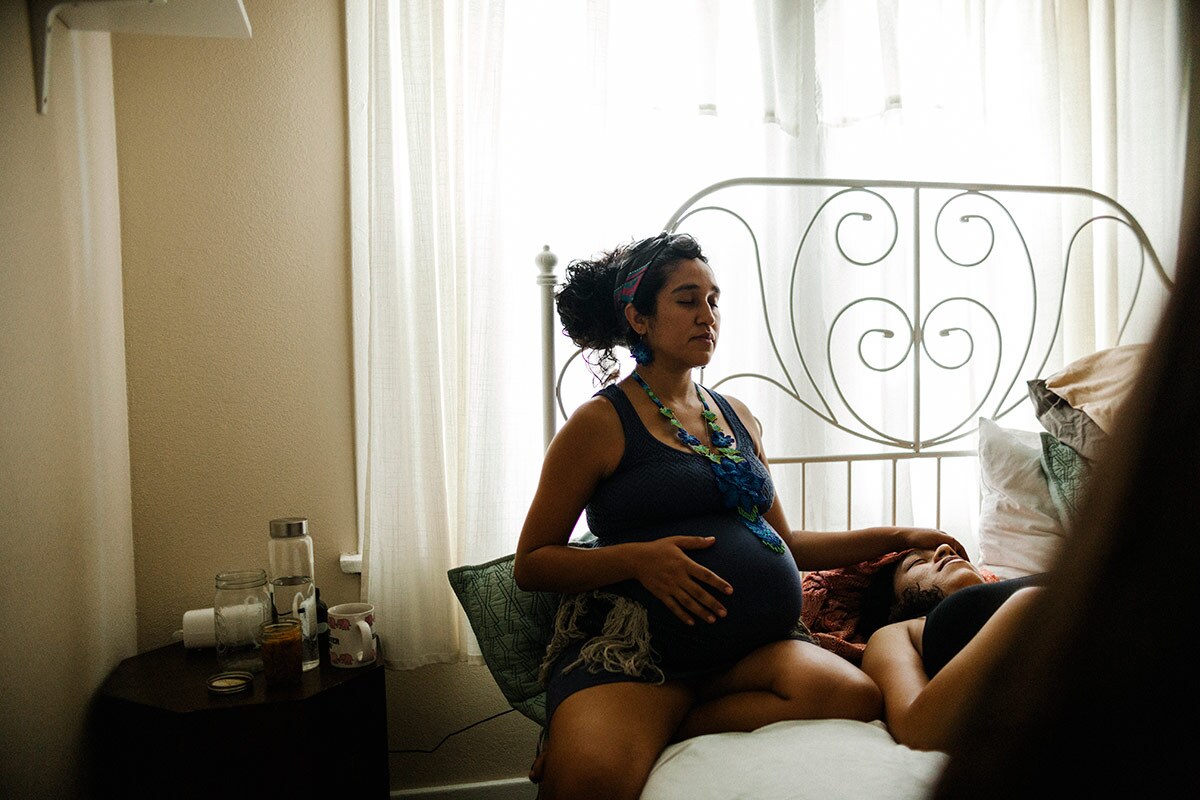 Panquetzani meditates with new mother Kat Cardenas