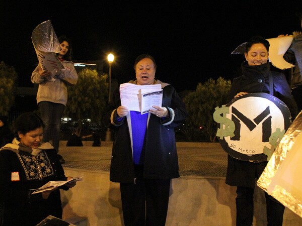 ELACC Resident Member Carmen Fuentes with ELACC Community Organizer Rey Fukuda performing a skit on the Boyle Heights Metro campaign | Photo by Sharis Degadillo