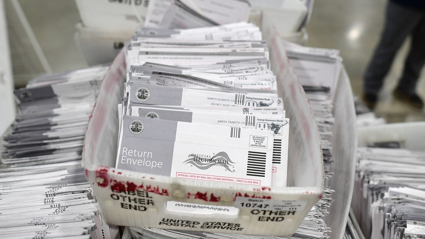 Mail-in ballots in their envelopes await processing at the Los Angeles County Registrar Recorders' mail-in ballot processing center at the Pomona Fairplex in Pomona, California, October 28, 2020. | ROBYN BECK/AFP via Getty Images