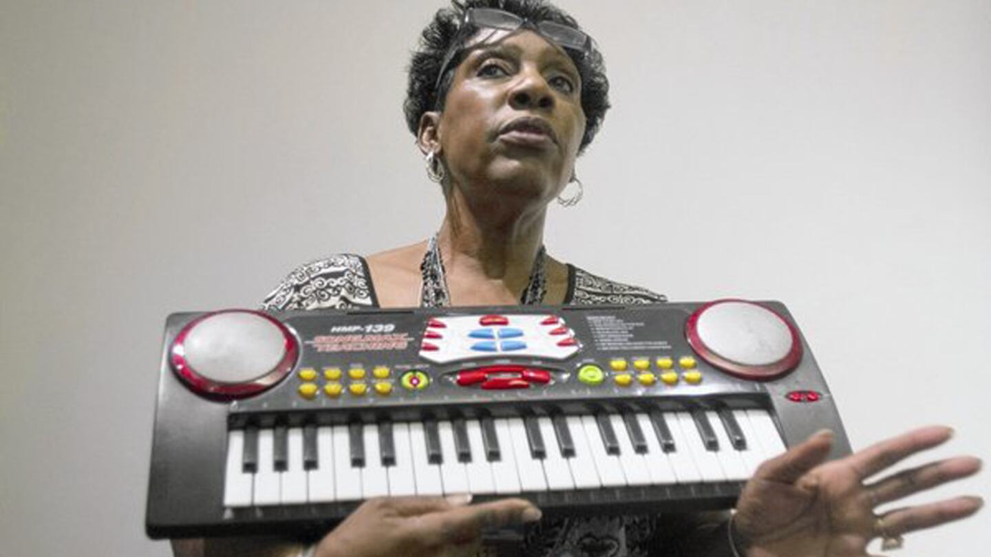 Arvis Jones Hathaway holding an electronic keyboard