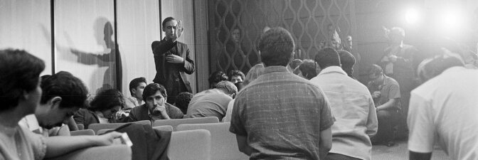 CSRC_LaRaza_B1F7C6_DW_001 Father John Luce saying a prayer at the Board of Education meeting | Devra Weber, La Raza photograph collection. Courtesy of UCLA Chicano Studies Research Center