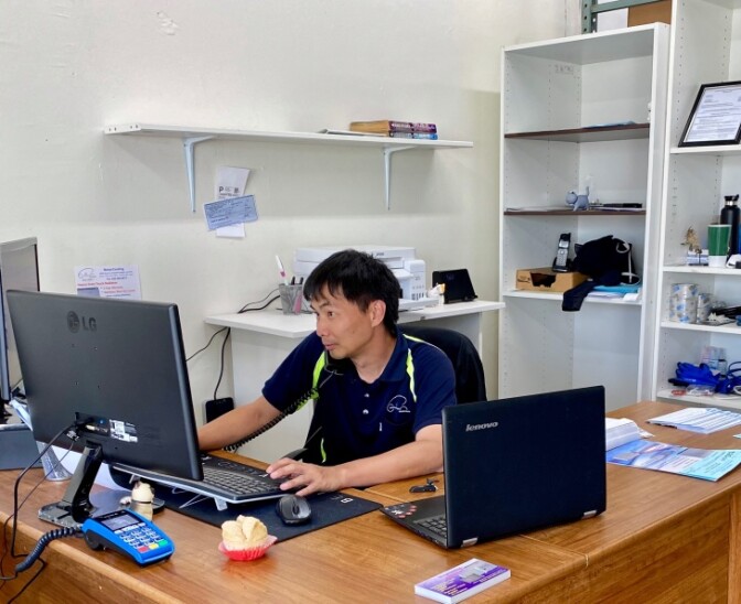 Leo Wong tries to navigate the web looking for information on SBA loans. | Photo courtesy of Leo Wong