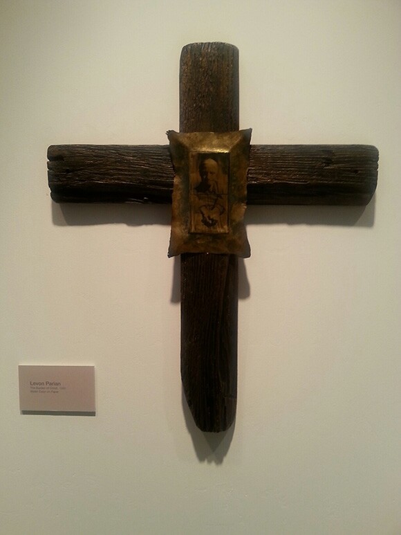 "The Burden of Christ" by Levon Parian, 1989, photo emulsion on brass; driftwood