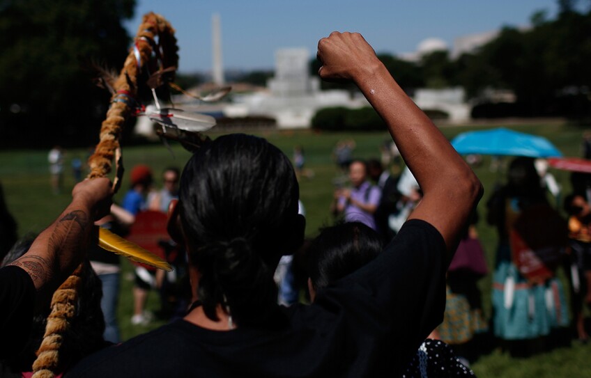 Members of the the San Carlos Apache Nation attend a protest outside the U.S. Capitol against a land swap that "threatens the sacred Apache Leap site with environmental damage from nearby high-risk copper." July 22, 2015. | Win McNamee/Getty Images