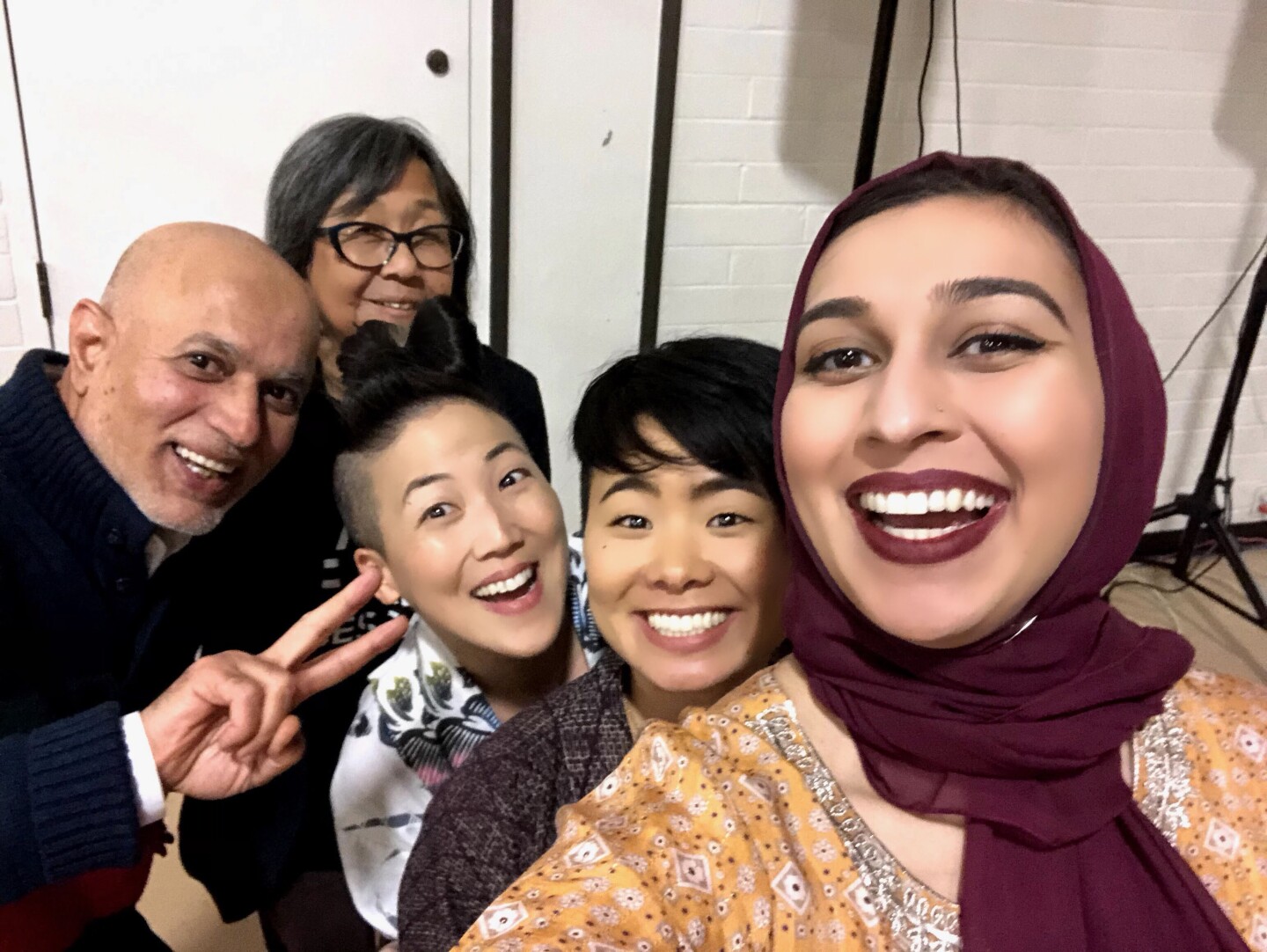 Vigilant Love community members Brother Shakeel Syed, Kathy Masaoka, traci kato-kiriyama, traci ishigo and Sahar Pirzada prepare for a Bridging Communities Iftar at Higashi Buddhist Temple.