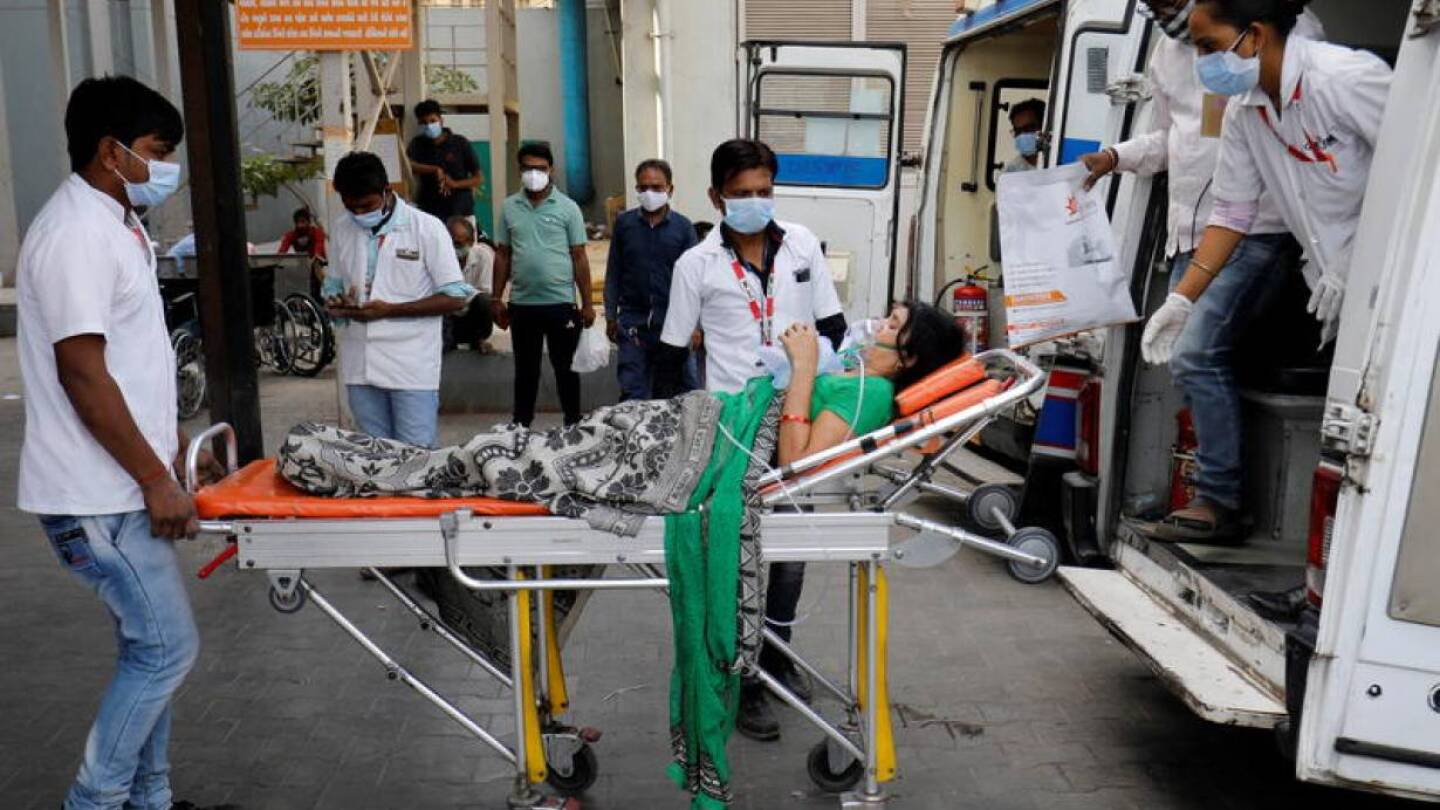 A patient wearing an oxygen mask is wheeled inside a COVID-19 hospital for treatment, amidst the spread of the coronavirus disease (COVID-19) in Ahmedabad, India, April 21, 2021.