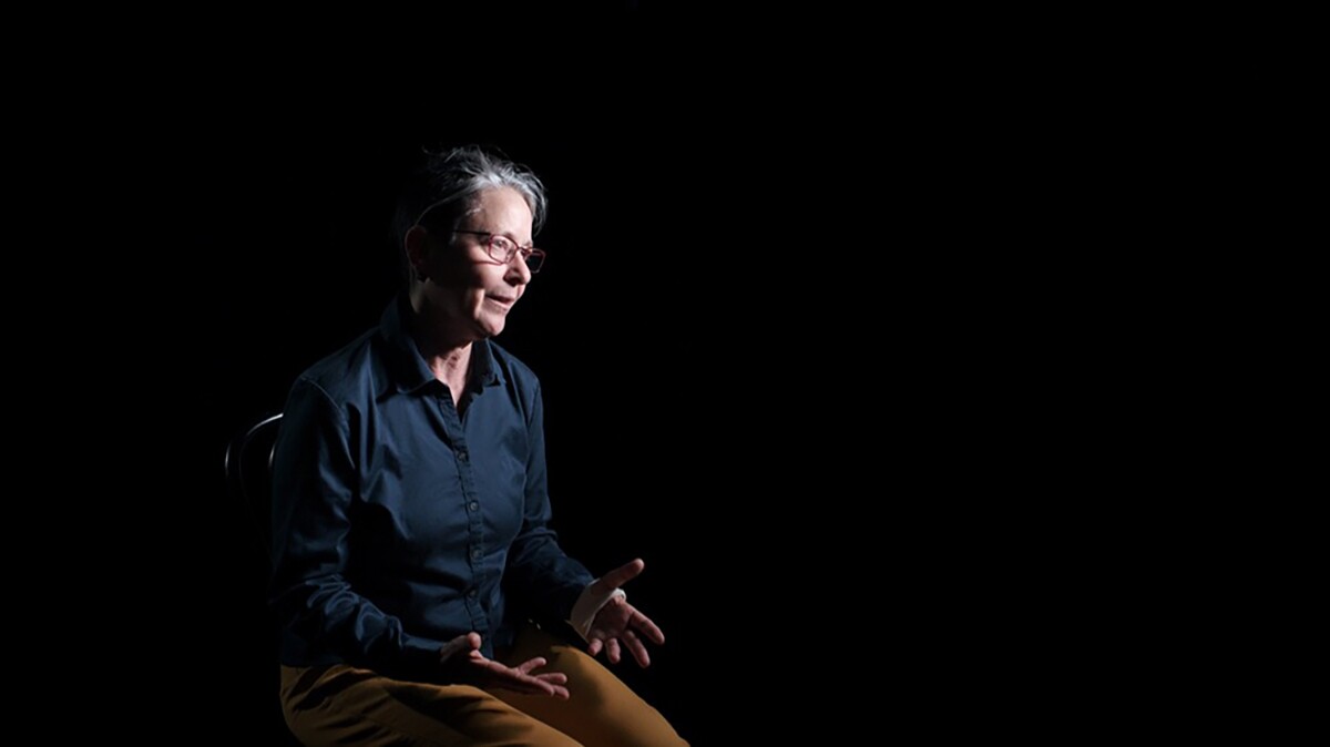 Victoria Marks sits in front of a black background. | Courtesy of Victoria Marks and UCLA