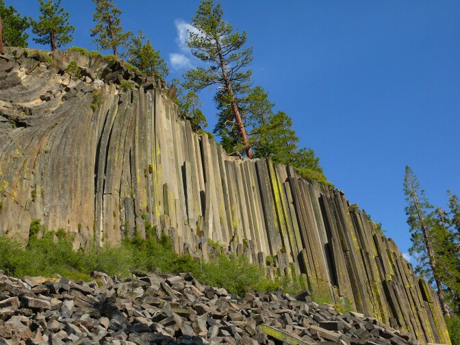 An unusual rock formation that looks like crystals jutting out from the mountain.