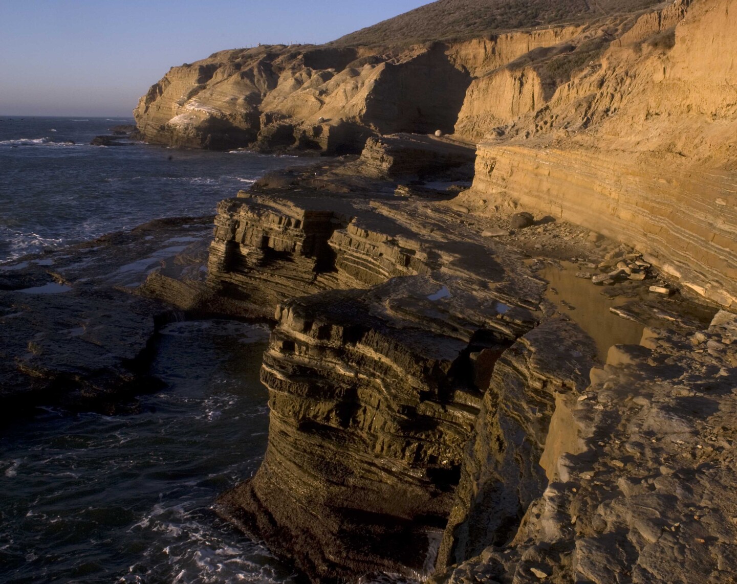 View of sandstone cliffs above the ocean