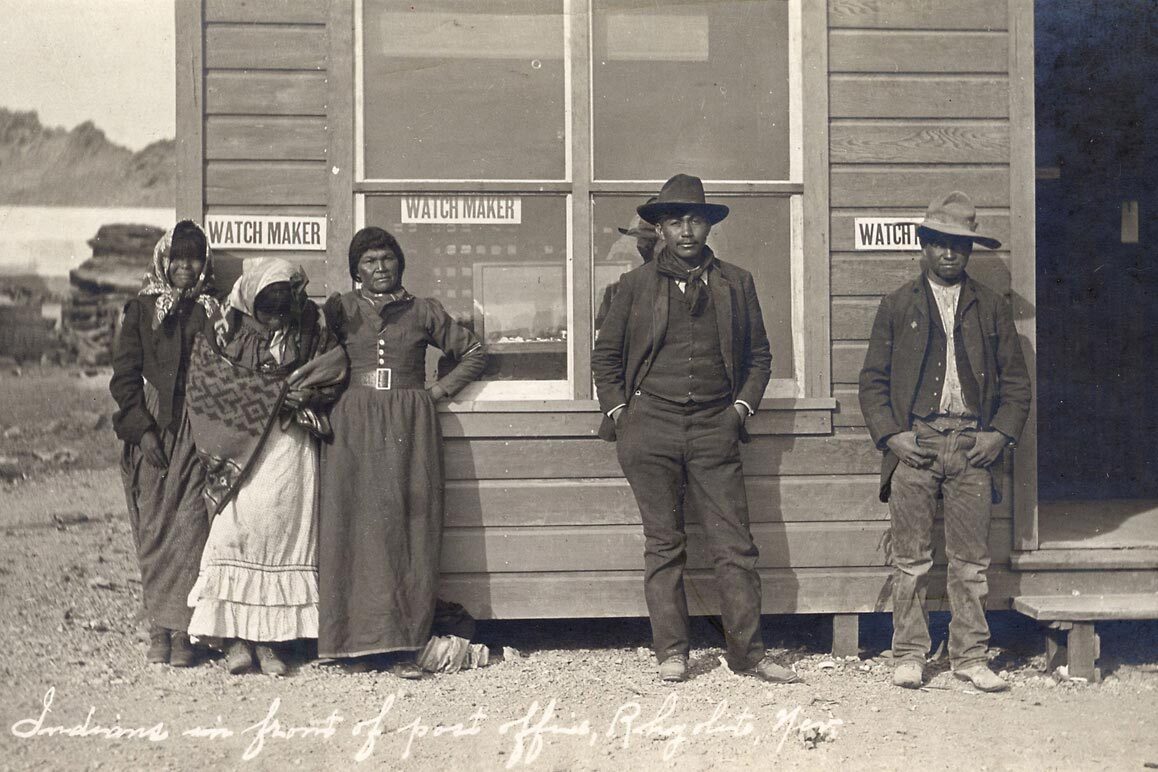 A group of Shoshone in front of Rhyolite's post office, ca. 1906. | A.E. Holt. Courtesy of University of Nevada, Reno, Special Collections.