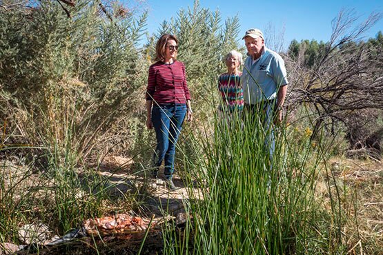 Susan Sorrells and Phil Pister with companion at the Shoshone pupfish refugium, Shoshone, CA. | Photo: Kim Stringfellow