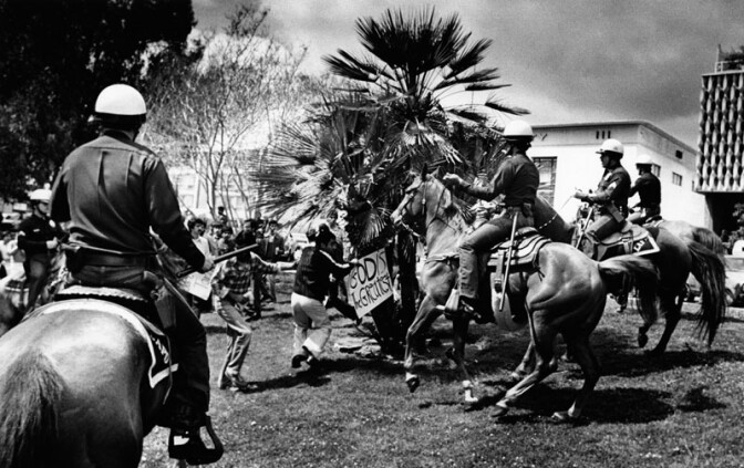 While most events were peaceful, clashes between police officers and protestors were not uncommon. The caption for this photograph dated March 30, 1981 reads, "Horses in LAPD patrol were used in crowd control last weekend at MacArthur Park.”