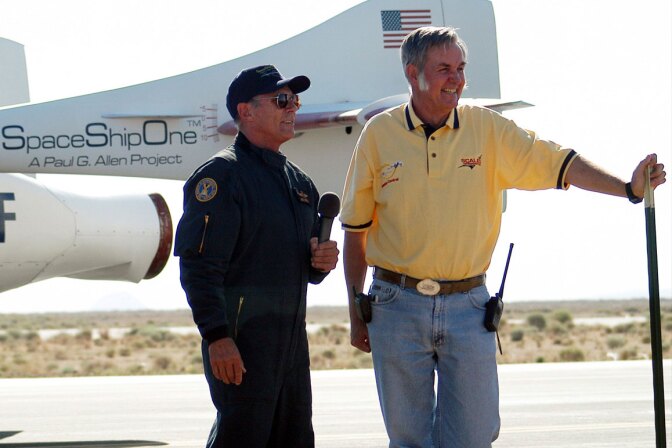 SpaceShipOne astronaut Mike Melvill (left) with Burt Rutan (right) speak to media after the first SS1 flight. | D. Ramey Logan/Wikipedia. (CC BY-SA 3.0)