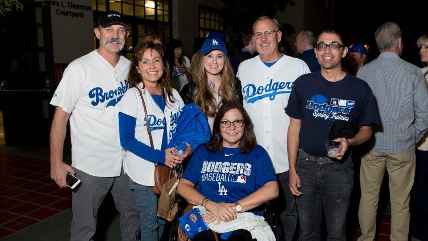 Longtime Dodgers fan, Scott Bell, and guests enjoy the reception after the screening at the Los Angeles Central Library on November 23, 2019.