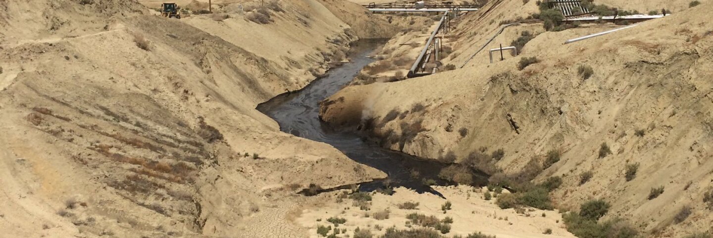 Photograph of "crude oil surface expression" at Cymric Oil Field. | Still by the California Department of Fish and Wildlife's Office of Spill Prevention and Response