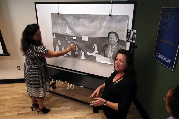 Sandy Rodriguez and Barbara Carrasco leading a mural workshop at UCR