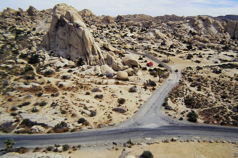 A 1970s aerial view of the Old Woman taken on top of Intersection Rock. This photo shows the old access road to Hidden Valley Campground | Tony Yeary