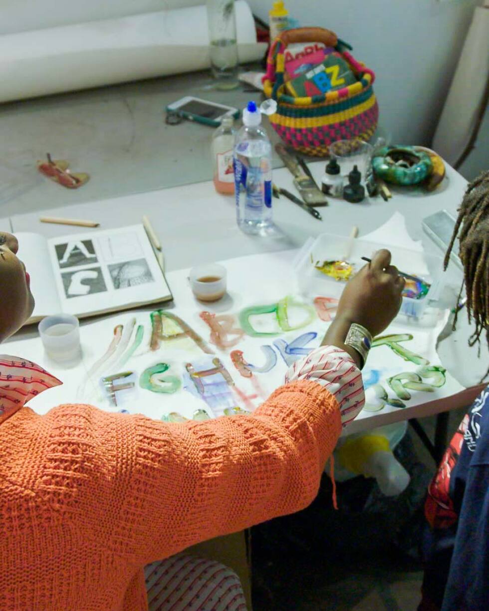 Artist Kenyatta A.C. Hinkle with her son, Johari | Still from KCET Artbound's "Artist and Mother" Mother AB s9