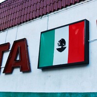 La Cita Sign with LA skyscraper in the back: Mexican flag, ":Cocktails," "Dancing" | Samanta Helou