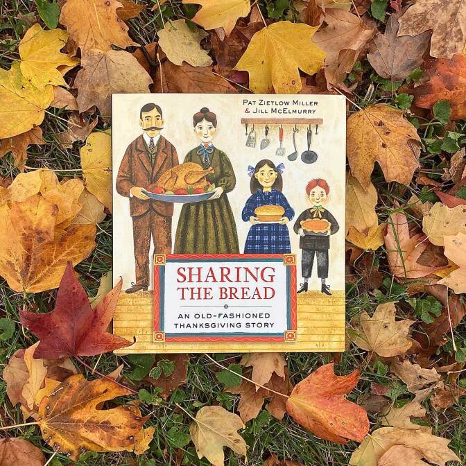 “Sharing the Bread: An Old Fashioned Thanksgiving Story” written by Pat Zietlow Miller and illustrated by Jill McElmurry book cover featuring an illustration of a family holding dishes of food. The book is sitting on top of fall leaves. Thanksgiving book list