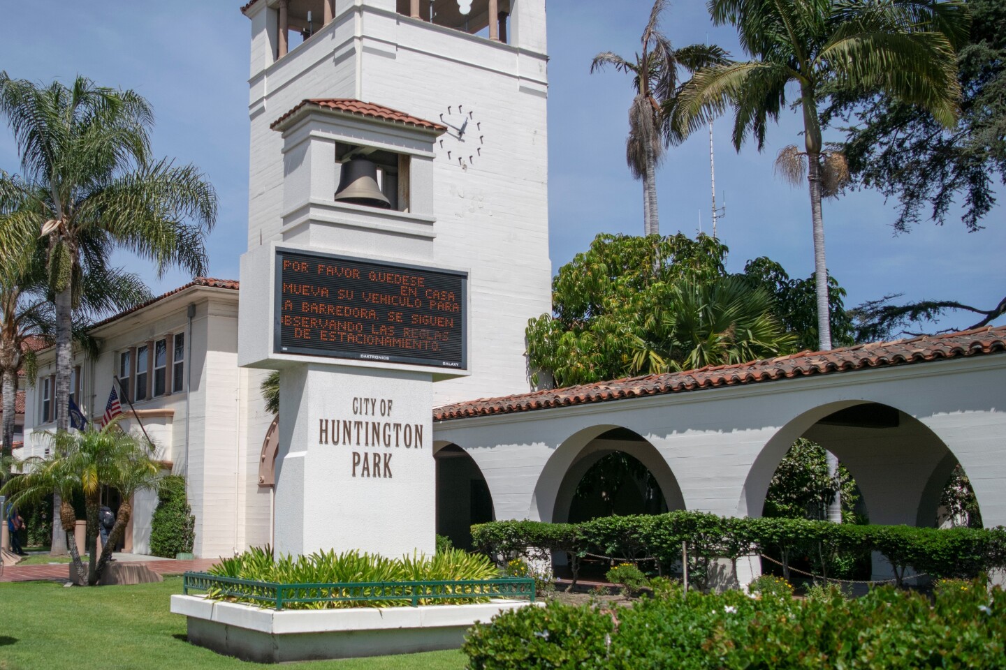 The city of Huntington Park sign in front of City Hall hosts a welcome message for residents passing by.