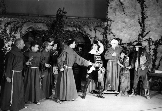 In this scene from 'The Mission Play,' Serra (white hair) and other mission fathers protect an Indian from a Spanish soldier. Courtesy of the Los Angeles Public Library Photo Collection.