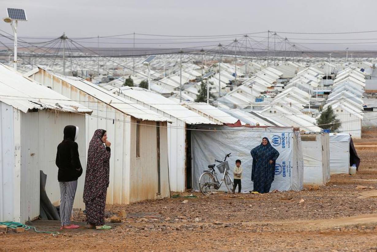 Syrian refugee women stand in front of their homes at Azraq refugee camp, near Al Azraq city, Jordan, December 8, 2018. REUTERS/Muhammad Ham