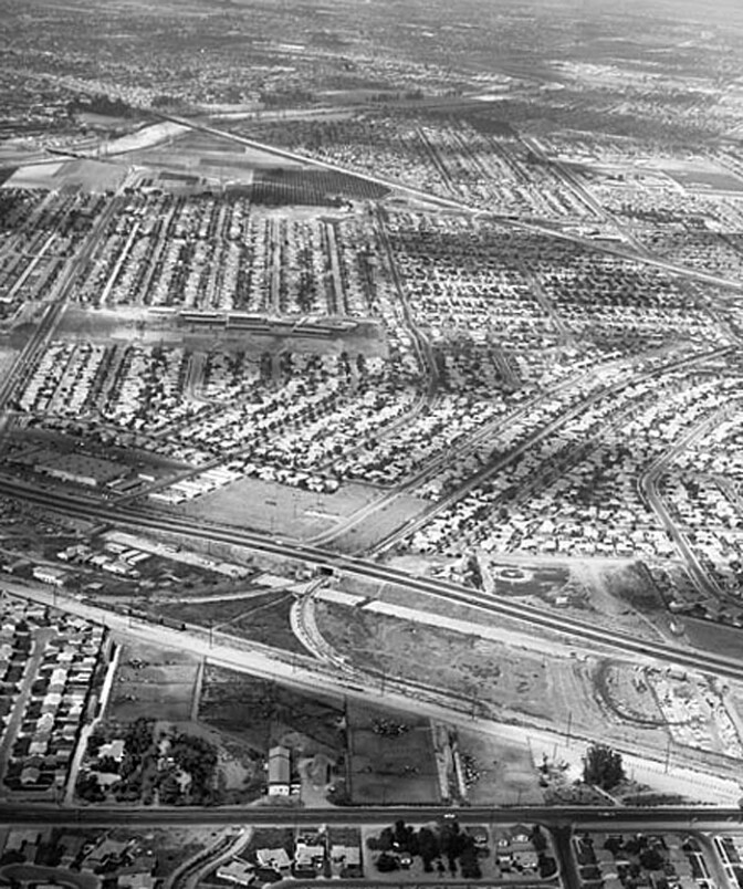 Dairy and owner's house surrounded by tract homes in Downey in 1957. Photo Courtesy of Kelly-Holiday Collection of Negatives and Photographs, Los Angeles Public Library