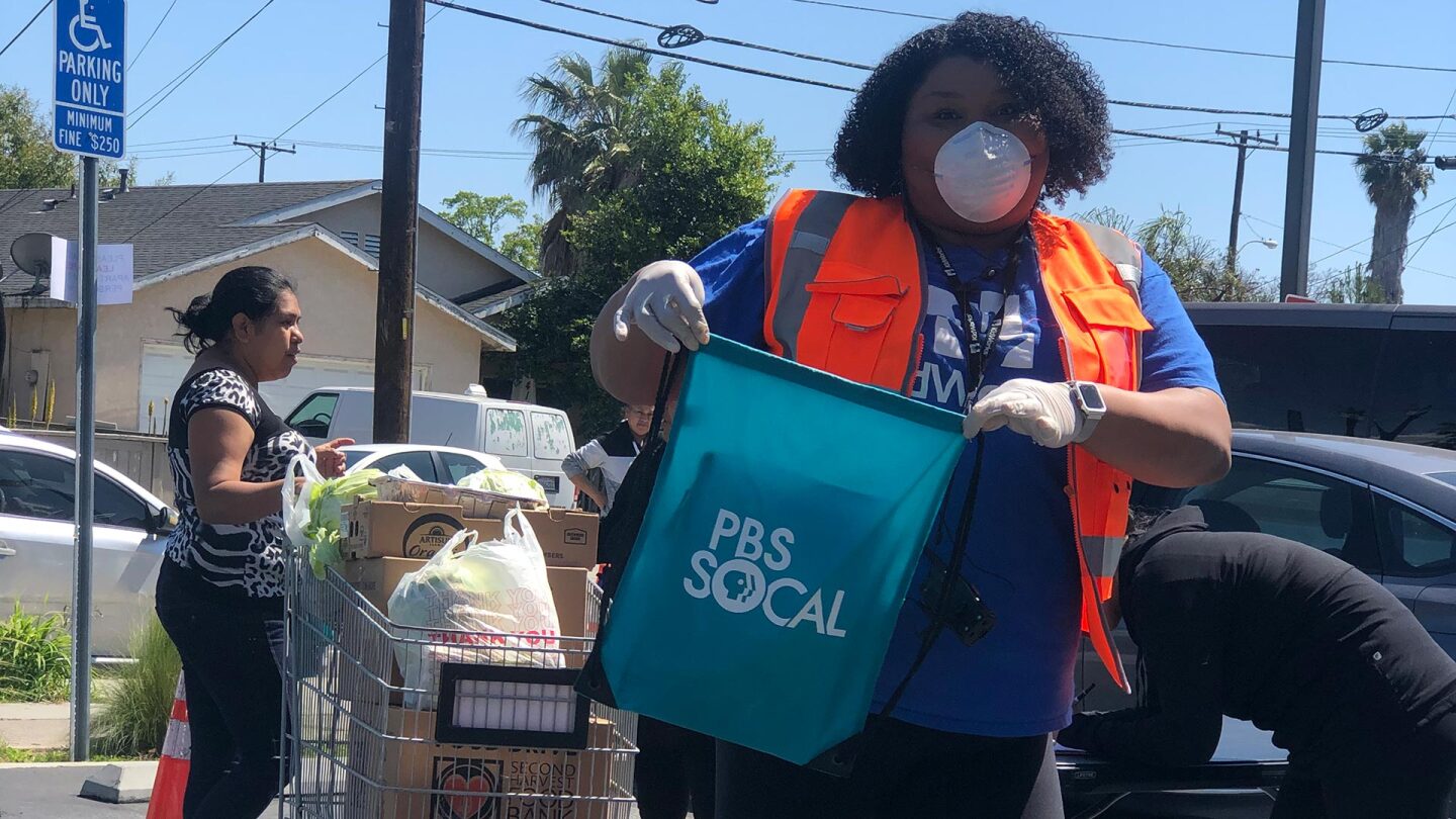 Jessica Ellis helps distribute backpacks