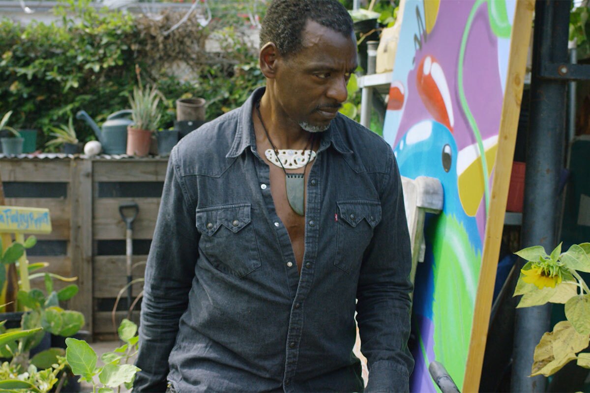 Ron Finley walks through his garden. | Still from "Broken Bread"