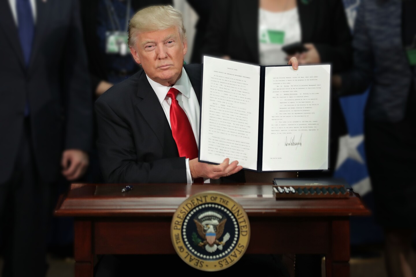 Pres. Trump Displays Executive Order Signed Jan. 25, 2017 | photo Chip Somodevilla/Getty Images
