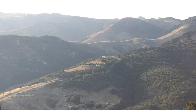 A hazy view of the Santa Ynez mountains and a few buildings in the distance. | Spencer Robins