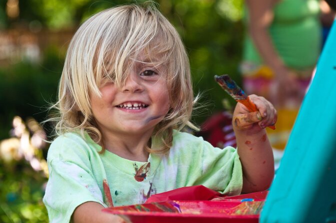 A child paints.
