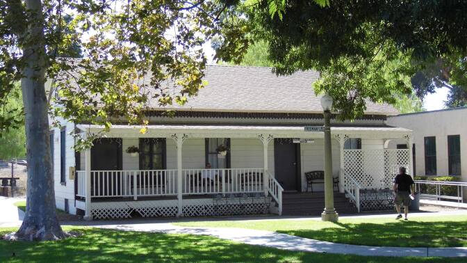 A building that stands in the Heritage Park Village Museum.