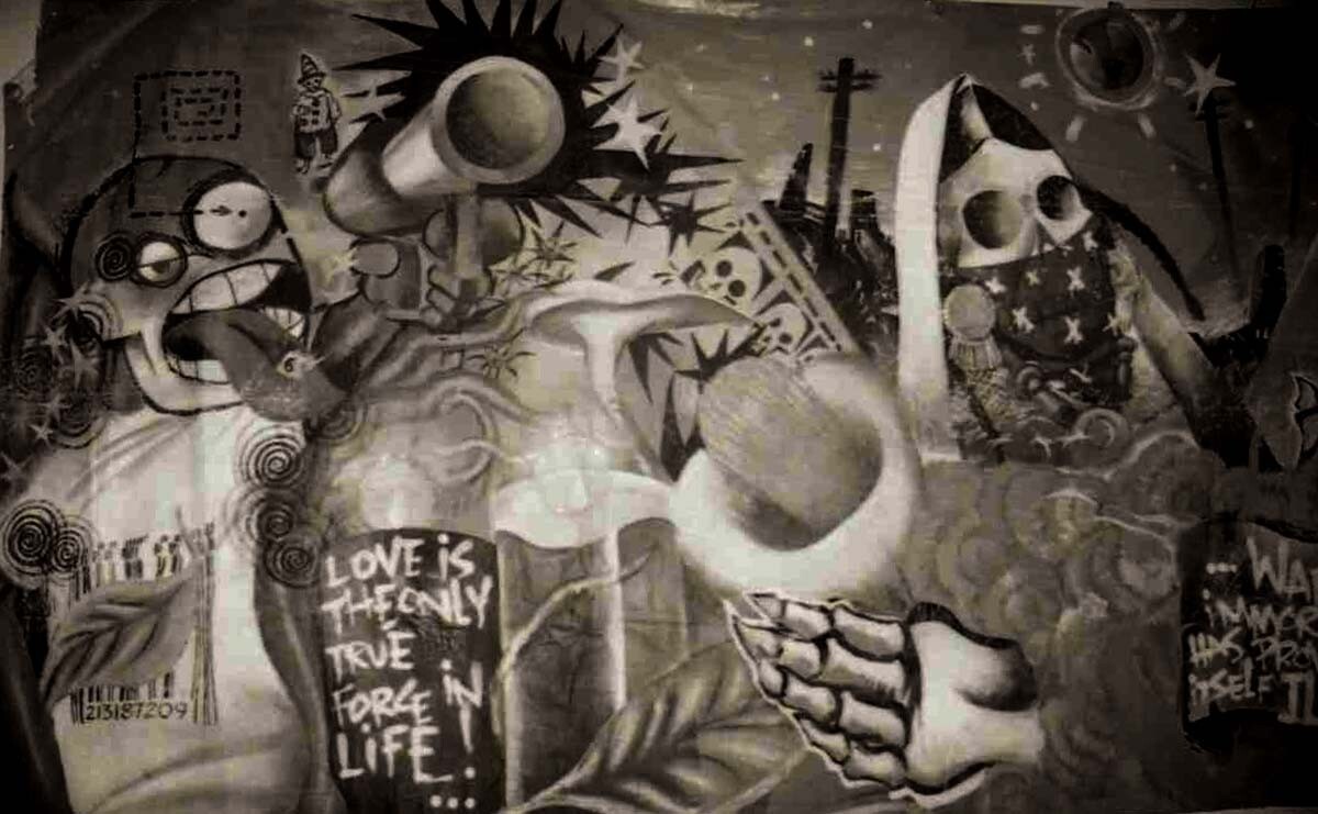 “Love is the Only True Force” mural by Nuke, black and white photo, 1999 | Sandra de la Loza