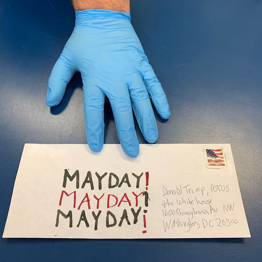 A gloved hand holds an envelope in Sean Griffin's contribution to Susan Silton's "Mayday! Mayday! Mayday!" project | Courtesy of Susan Silton