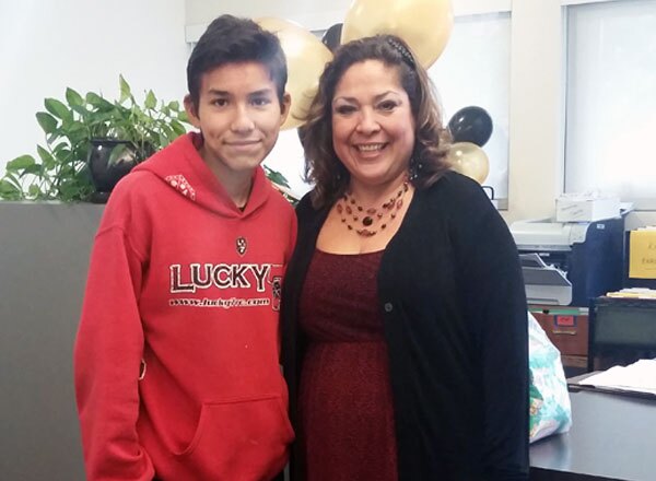 Mrs. Laura Barrios, Wright School Administrative Assistance with student reporter