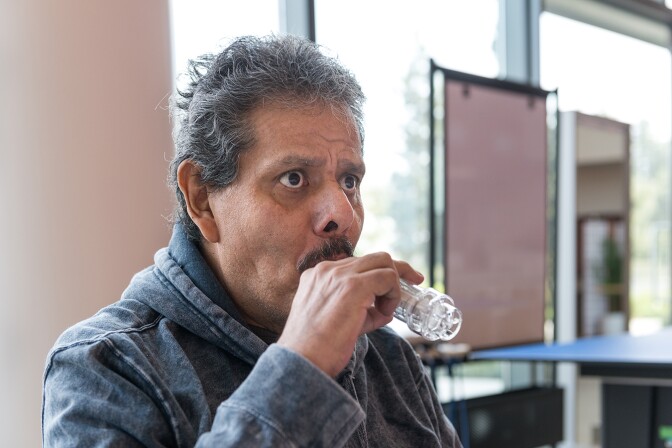 Perez uses a breathing trainer during his therapy.
