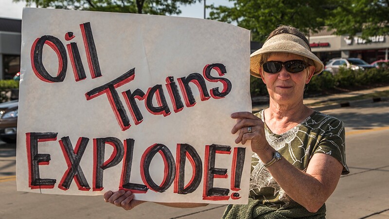 A demonstrator opposes shipping Bakken crude through her community | Photo: Overpass Light Brigade, some rights reserved