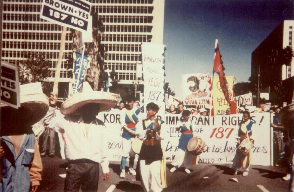 Thousands of people take to the streets of Los Angeles in 1994 to protest Proposition 187